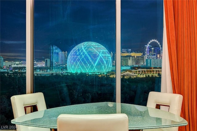 360 E Desert Inn Rd Unit 1402, Las Vegas, NV 89109 - dining room featuring a view of city lights