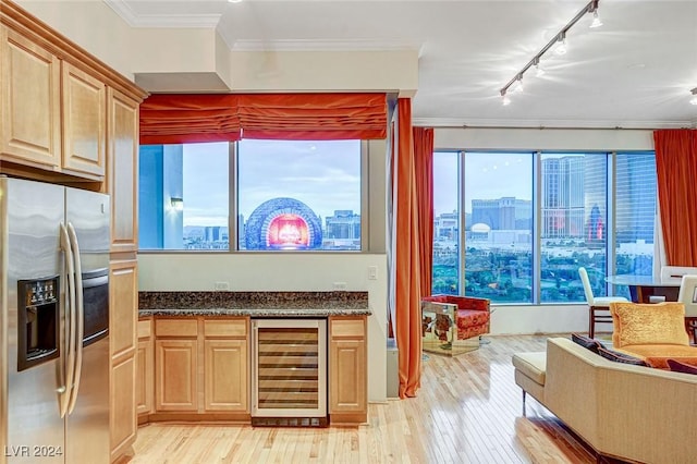 kitchen featuring beverage cooler, stainless steel fridge with ice dispenser, crown molding, light hardwood / wood-style floors, and track lighting