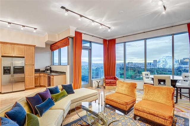 360 E Desert Inn Rd Unit 1402, Las Vegas, NV 89109 - living room featuring rail lighting, healthy amount of natural light, ornamental molding, a city view, and light wood-type flooring