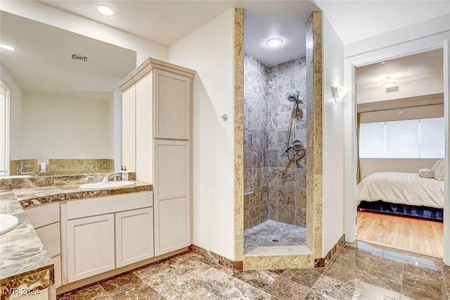 360 E Desert Inn Rd Unit 1402, Las Vegas, NV 89109 - ensuite bathroom featuring walk in shower, double vanity, and recessed lighting