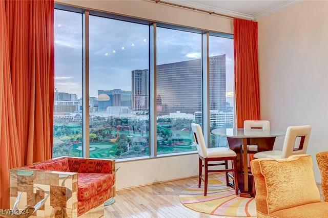 360 E Desert Inn Rd Unit 1402, Las Vegas, NV 89109 - living area featuring wood finished floors, crown molding, and a view of city