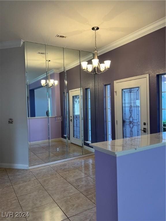 kitchen featuring ornamental molding, hanging light fixtures, and an inviting chandelier