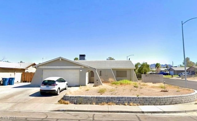 single story home featuring a garage