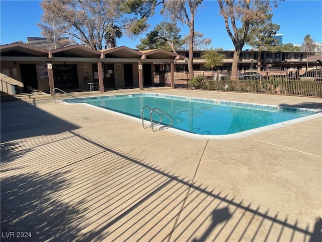 view of swimming pool featuring a patio