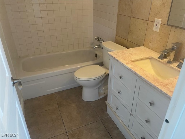 full bathroom featuring decorative backsplash, vanity, tile walls, tile patterned flooring, and toilet