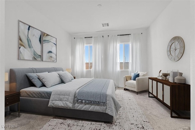 bedroom with light colored carpet