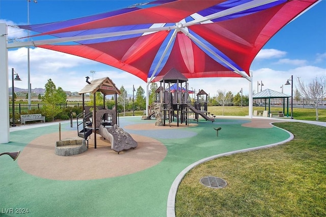 view of playground featuring a gazebo and a lawn