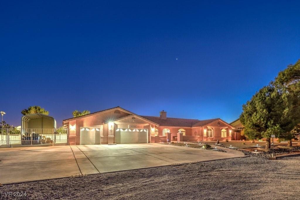 single story home with a garage and a carport