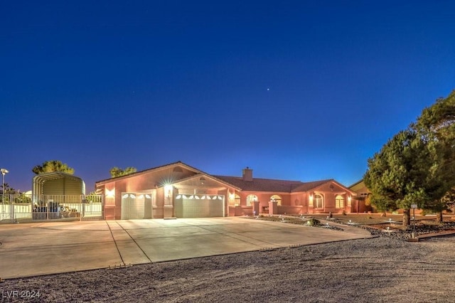 single story home with a garage and a carport