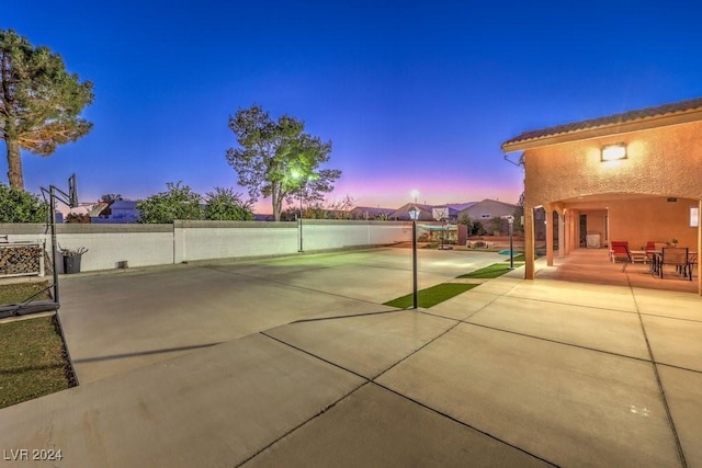 view of patio terrace at dusk