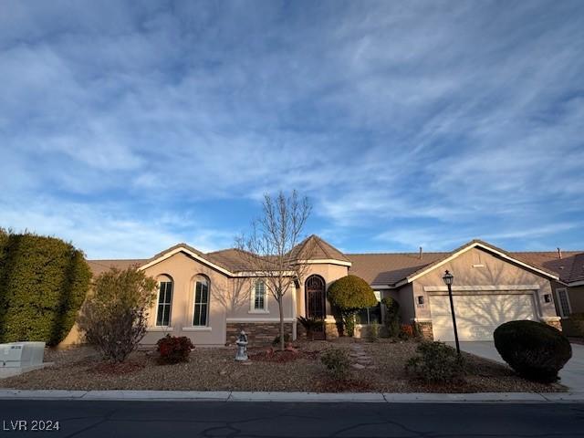 single story home with a garage