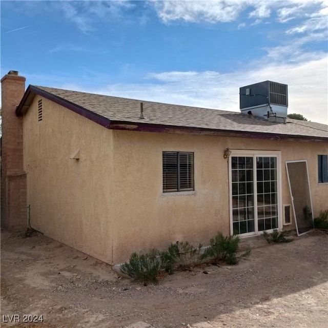 view of home's exterior with cooling unit