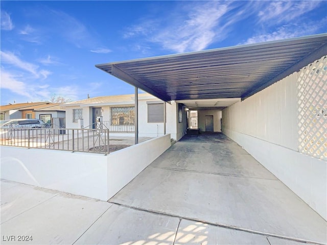 exterior space with a carport