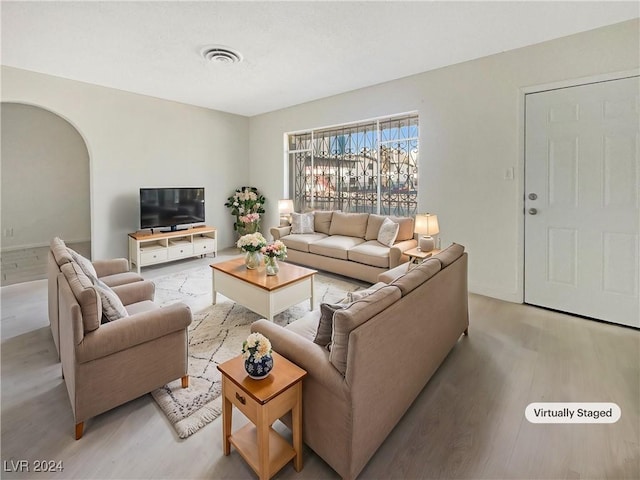 living room with light hardwood / wood-style flooring