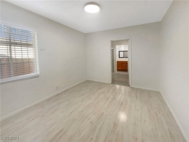 empty room with light wood-type flooring