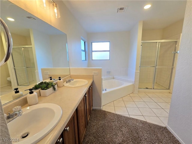 bathroom featuring separate shower and tub, tile patterned flooring, and vanity