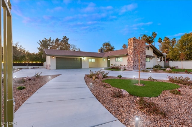 ranch-style home featuring a garage