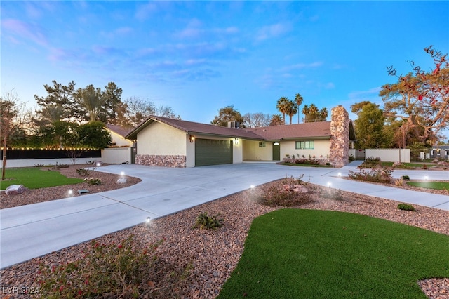 ranch-style home featuring a garage