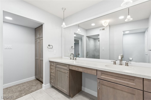 bathroom with vanity, tile patterned floors, and a shower with shower door