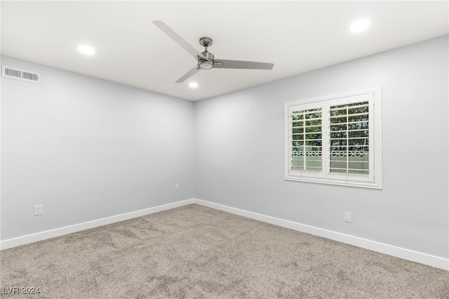 carpeted empty room with ceiling fan