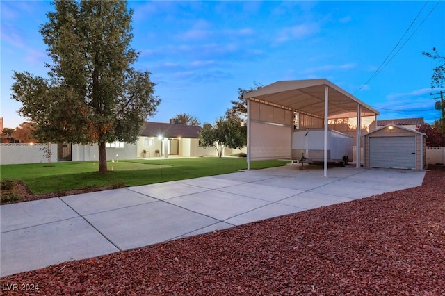 exterior space featuring a carport and an outbuilding