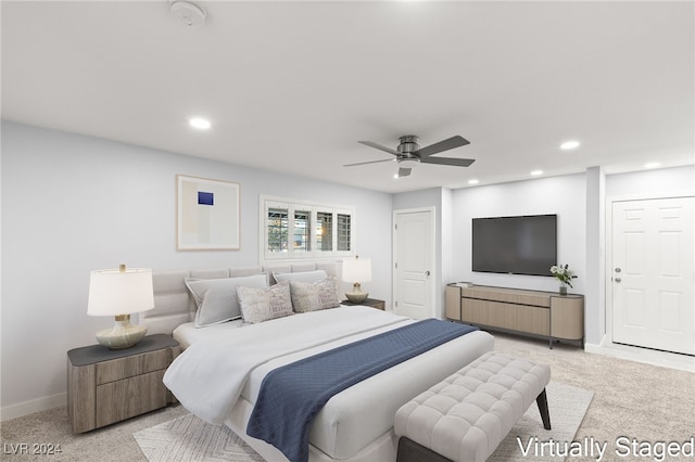 carpeted bedroom with ceiling fan