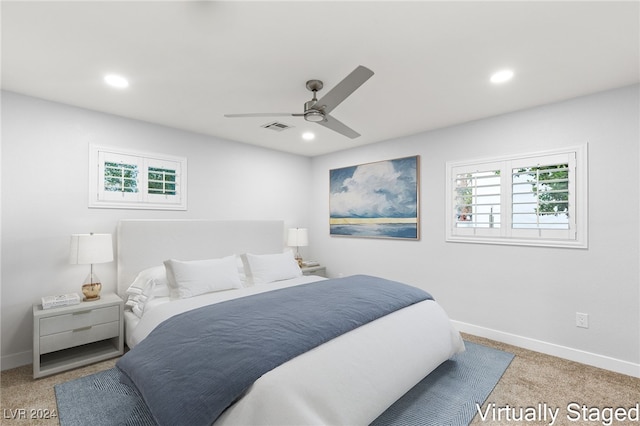 carpeted bedroom featuring ceiling fan