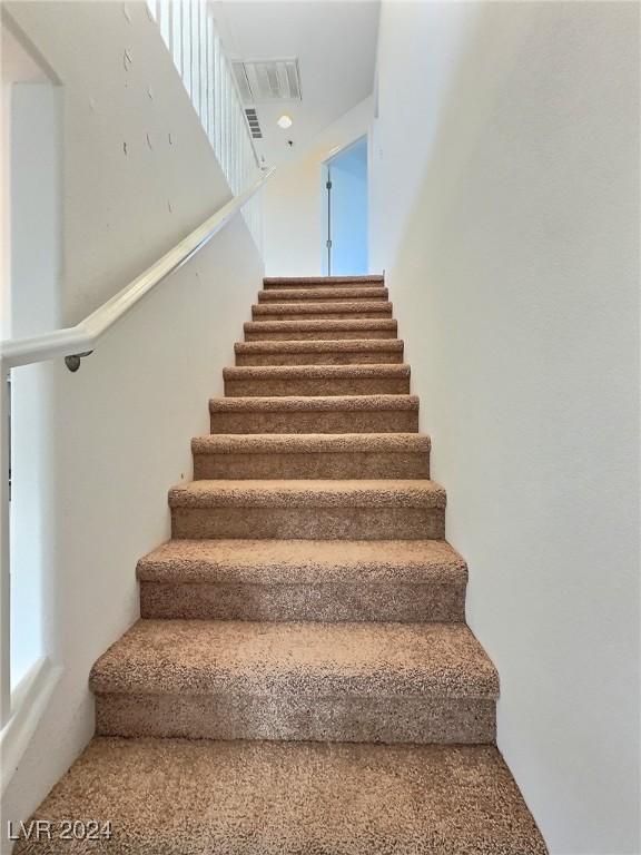 staircase with carpet