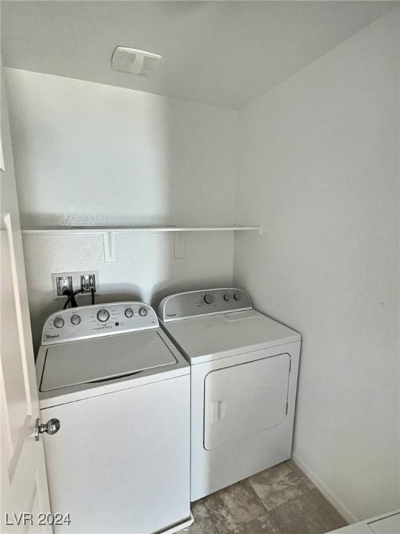 washroom featuring washer and dryer