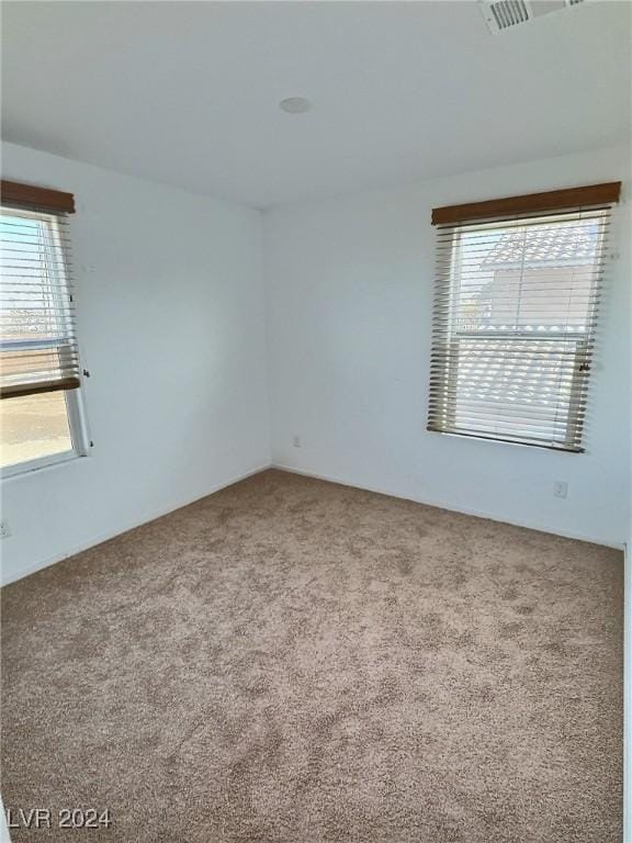 spare room featuring carpet