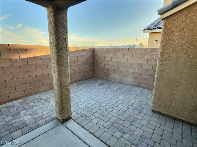 view of patio terrace at dusk