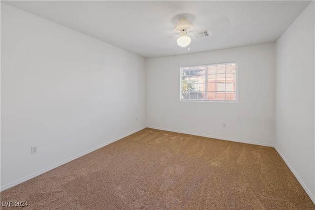 empty room with carpet flooring