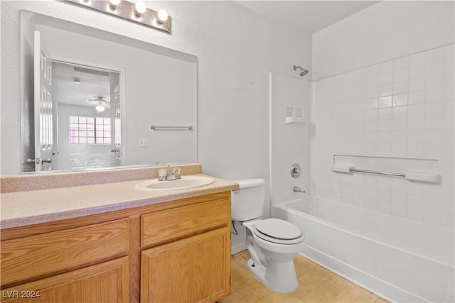 full bathroom featuring bathtub / shower combination, vanity, and toilet