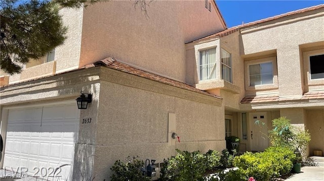 view of property exterior with a garage