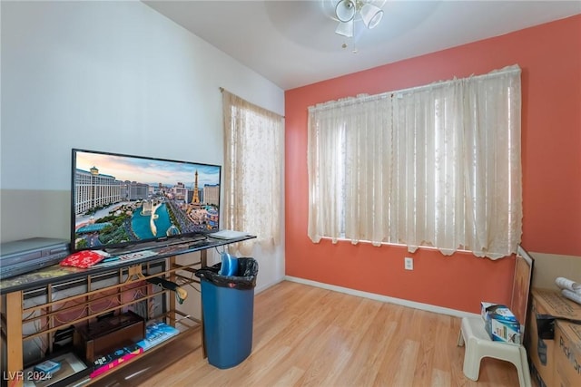 office area with light hardwood / wood-style floors and ceiling fan