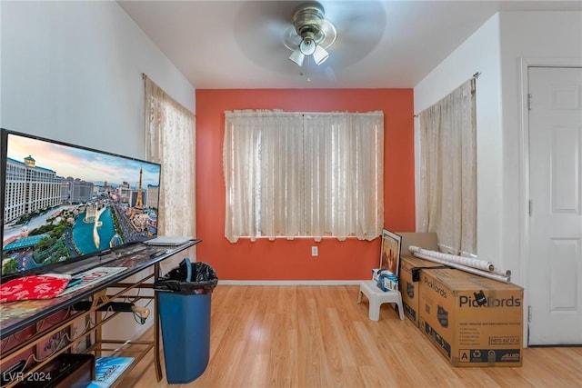 home office featuring hardwood / wood-style floors and ceiling fan