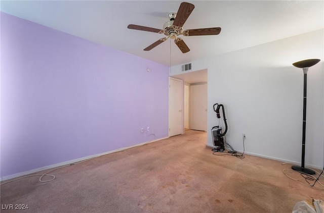 empty room with light colored carpet and ceiling fan