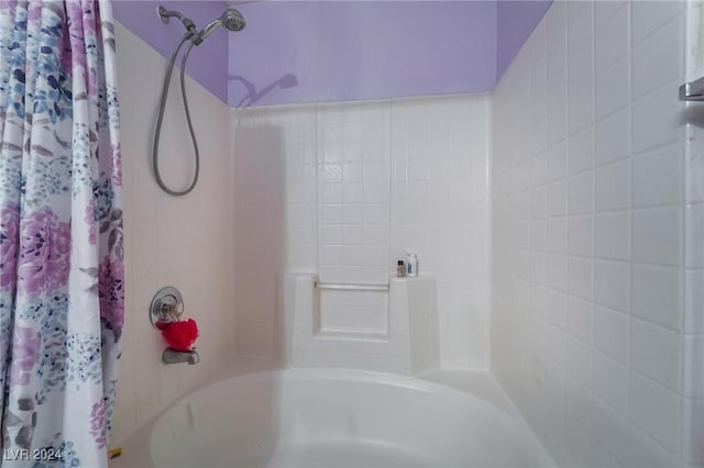 bathroom featuring shower / bathtub combination with curtain