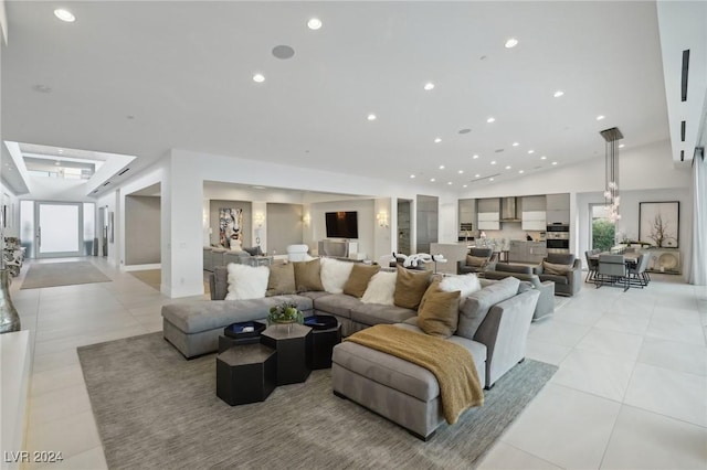 living room featuring light tile patterned flooring and vaulted ceiling