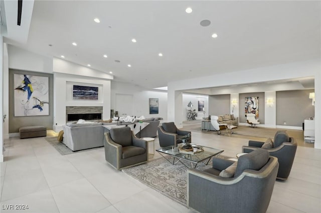 tiled living room with lofted ceiling