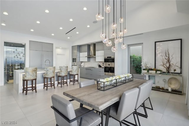 tiled dining area featuring lofted ceiling