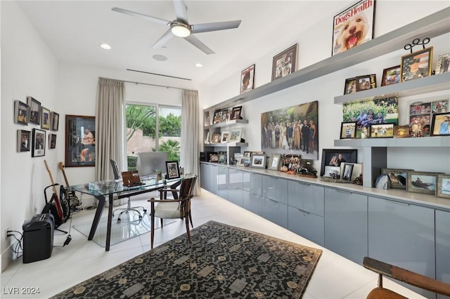 tiled office space featuring ceiling fan