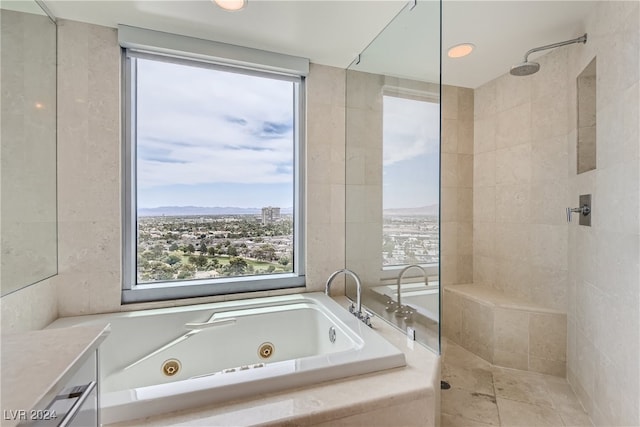 bathroom with vanity and plus walk in shower