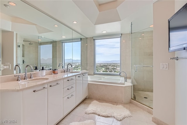 bathroom featuring vanity, tile patterned floors, and plus walk in shower