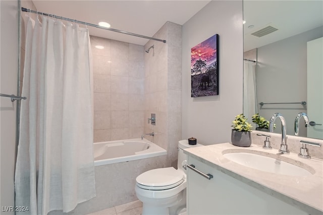 full bathroom with tile patterned flooring, toilet, vanity, and shower / bath combination with curtain