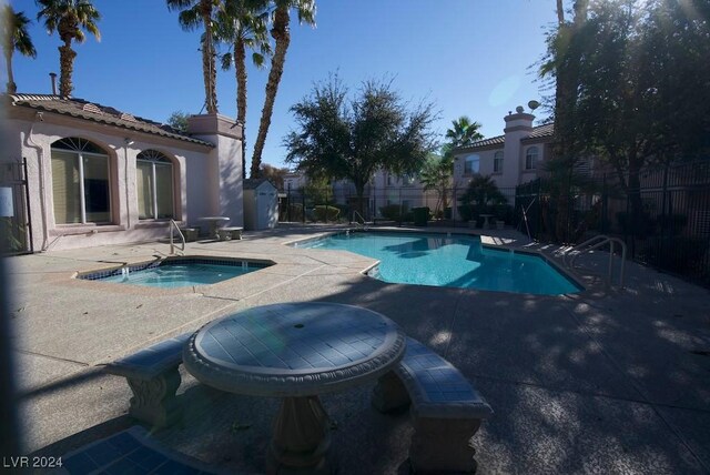 4555 E Sahara Ave Unit 223, Las Vegas, NV 89104 - community pool featuring a hot tub and a patio