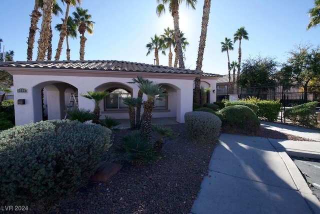 4555 E Sahara Ave Unit 223, Las Vegas, NV 89104 - mediterranean / spanish-style house featuring stucco siding and a tiled roof
