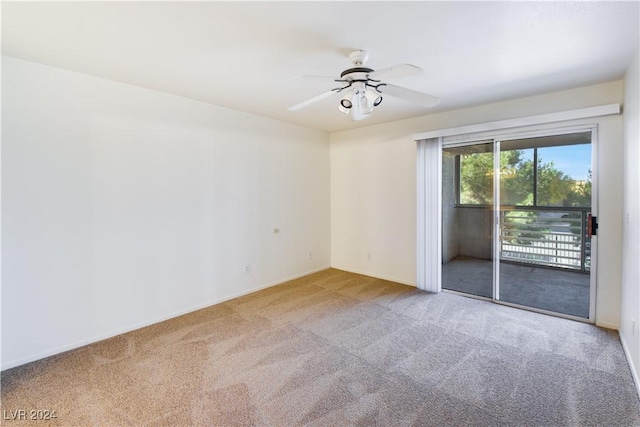 spare room featuring carpet flooring and ceiling fan