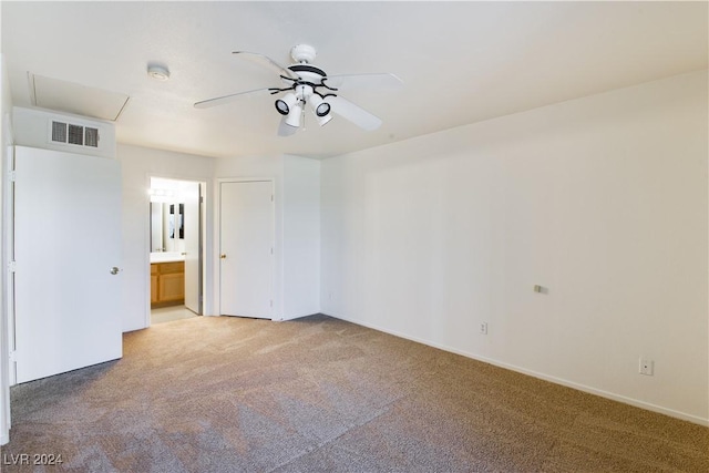 carpeted spare room featuring ceiling fan