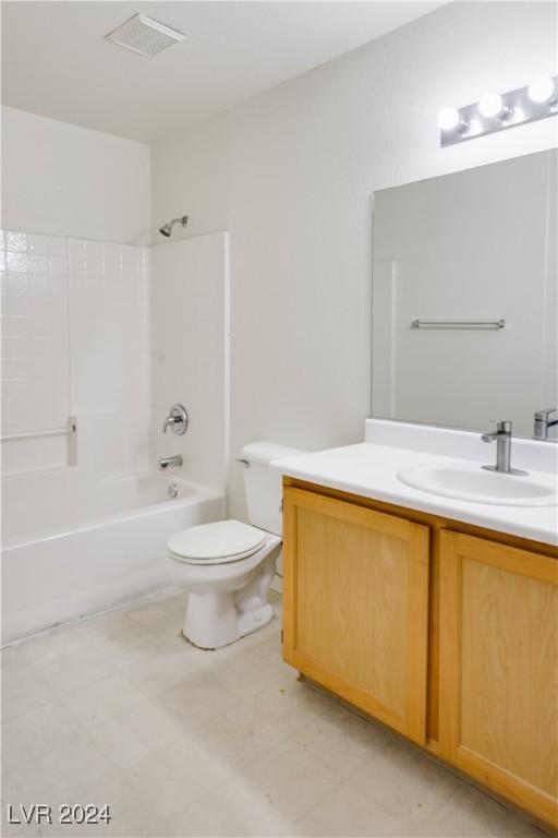 full bathroom featuring vanity, toilet, and washtub / shower combination